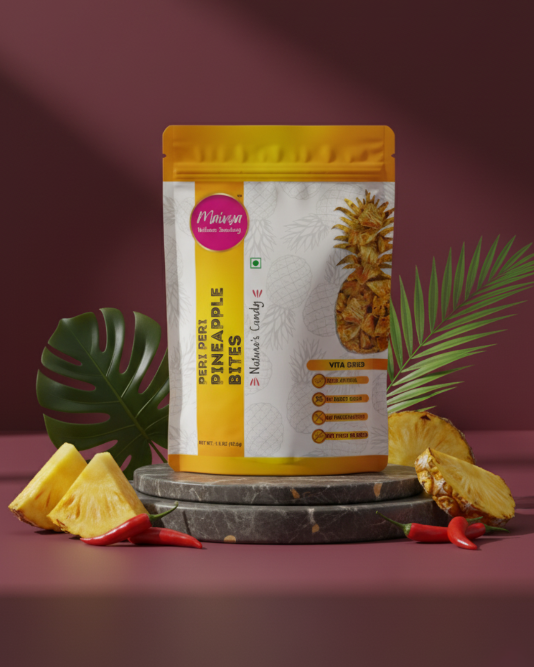 Maivya Peri Peri Pineapple Bites displayed with fresh pineapple and red chilli, showcasing a bold sweet-spicy snack made with Vita-Drying technology.